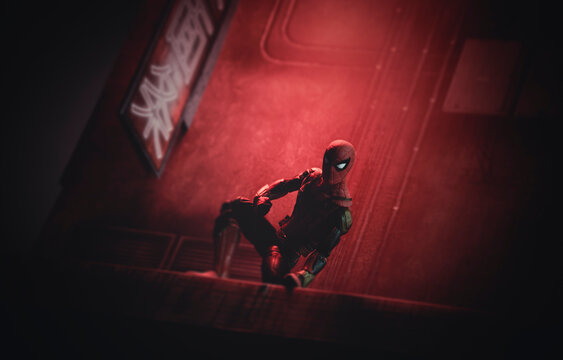 NEW YORK USA, JULY 31 2022: Marvel comics superhero Spiderman watching from a rooftop - Hasbro action figure