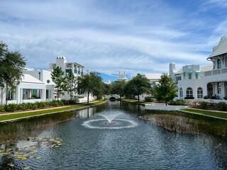 A walking path with water feature and homes in Alys Beach, Florida.