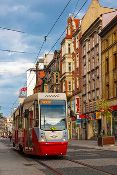 KATOWICE, POLAND - JULY 28, 2015: Red tram (model: Konstal 105N-2K) on the street of Katowice. Silesian Interurbans system spreads over 50km and covers 13 towns in the Upper Silesia metropolitan area