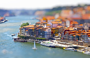 Fototapeta na wymiar Aerial view of old center of City of Porto and Douro river, Portugal. Tilt-shift Miniature Effect