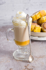 pumpkin cinnabons and latte for dessert, holiday table with pastries, home sweet