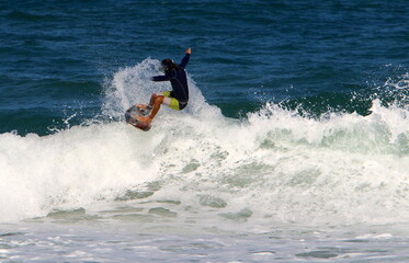 Surfing on high waves in the Mediterranean.