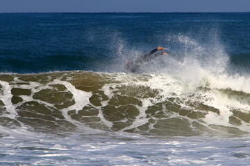 Surfing on high waves in the Mediterranean.