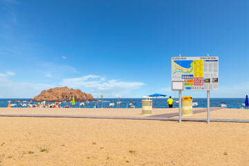 The sandy Platja Gran beach at the resort town of Tossa de Mar, Spain, on the Costa Brava coast of the Mediterranean Sea.	