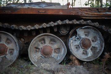 Fototapeta na wymiar The smashed and burned modern tank of the russian army in Ukraine in the war in 2022