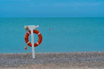 Sea safety water rescue buoy life blue equipment ring save, concept security travel from vacation from ocean assistance, emergency waves. Motion lifebelt protect,