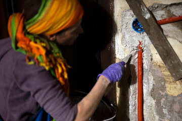 Female Restoring Electrical Power Line in An Old House