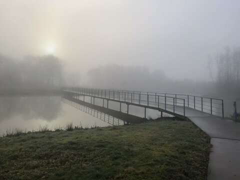 Morning mist over the river and the bridge