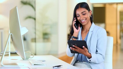 Happy manager talking on a phone, laughing while working in modern office. Booking appointment or a meeting on tablet. Young, carefree professional female talking to a client while sending an email
