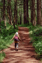 Fototapeta premium Woman walking or slow running on the nature trail,
