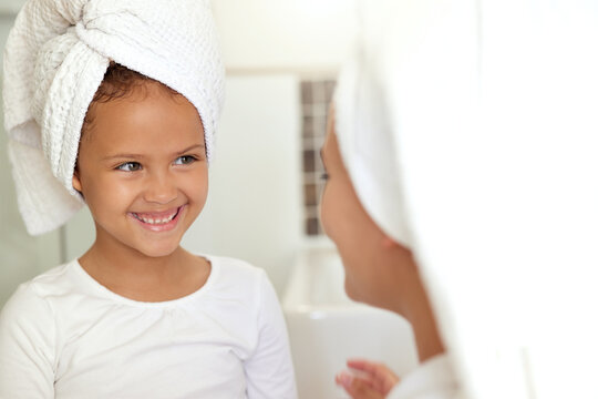 Hygiene, Washing Hair And Grooming With Haircare Routine In A Mother And Daughter Home Spa Day. Happy, Caring And Sweet Child And Parent Bonding Over Healthy Skincare Or Relaxing Pampering Treatment