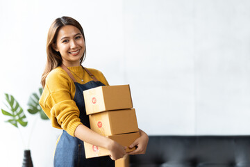 Starting small businesses SME owners female entrepreneurs check online orders to prepare to pack the boxes, sell to customers, sme business ideas online.