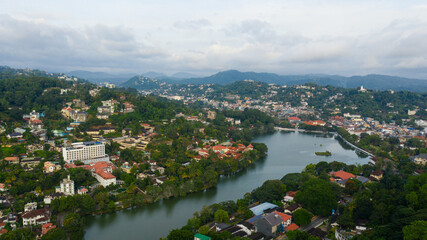 Aerial drone of Kandy Lake and Kandy city aerial panoramic view. View from top of the mountain over Kandy.