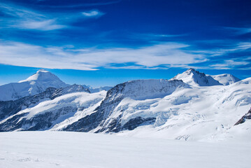 Fototapeta na wymiar Snow filled mountain, Jungfrau, Alps, Along the glacier 