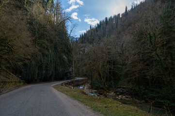 Fototapeta na wymiar Mountain road with steep cliffs. Beautiful road landscape