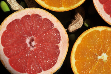 Fresh oranges and kiwi sliced on a plait