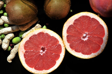 Fresh oranges and kiwi sliced on a plait