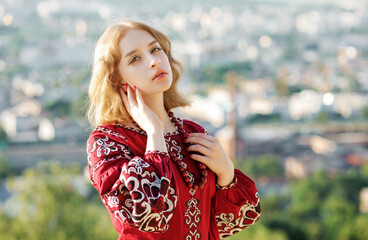 Portrait of a beautiful blonde in traditional national clothes.