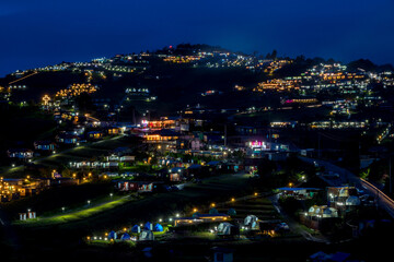 Fototapeta premium The village in the mountains at night. Small village in high mountains in Thailand.