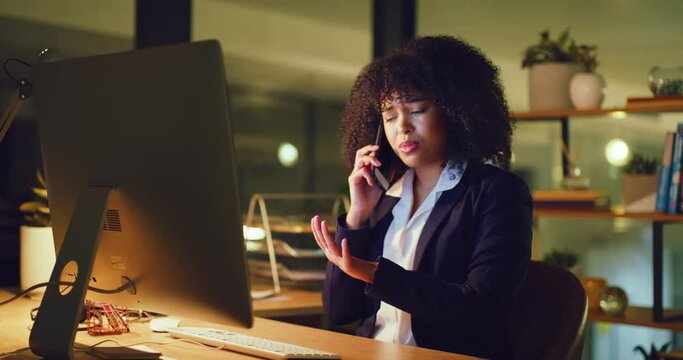 Young, angry and stressed businesswoman talking on phone call while trying to reach a deadline, complete a task or send emails in an office late at night. Worker looking frustrated, mad and irritated