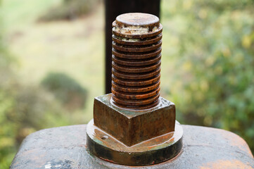 A large, rusty metal bolt