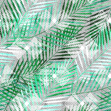 Seamless tropical pattern. Green palm leaves on textured light gray.
