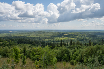 View of the endless forests of the Urals from the top of the White Mountain (Perm region, Russia) in summer.