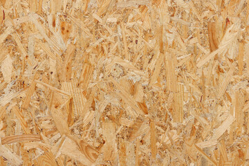 Seamless texture of oriented strand board OSB wood plank for background.