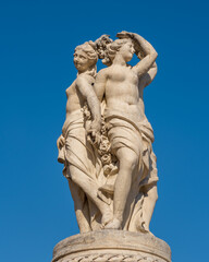 View of the statue of the Three Graces, elegant stone sculpture of the fountain on the famous landmark Place de la Comedie, Montpellier, France