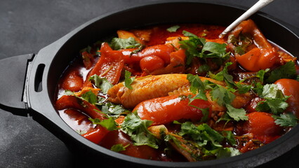 Moroccan fish  with chermoula, red peppers and preserved lemon. Spicy traditional  Moroccan food
