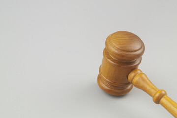 Wooden judge gavel on gray background, copy space for text. Laws, justice, court and legal system concept.