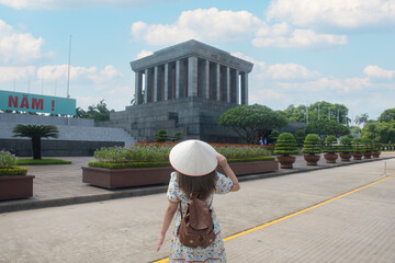 Woman traveller is sightseeing at Ho Chi Minh Mausoleum in Hanoi, Vietnam.