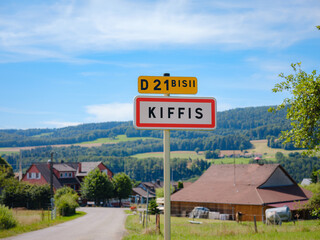 Road sign at entrance of French mountain village Kiffis