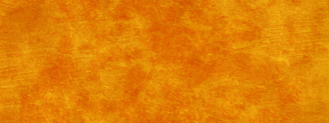 Abstract shinny and soft orange or yellow background texture with grainy stains, bright and shinny yellow or orange watercolor shades grunge background with space for your text.