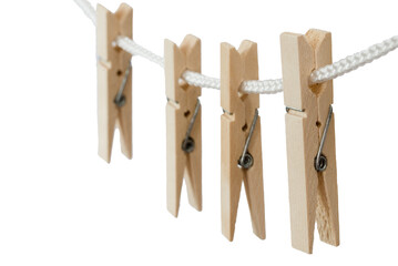 Den Helder, Netherlands. July 2022. Wooden clothes pegs on a white background. Selective focus.