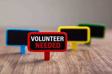 Volunteer Needed word on wooden board