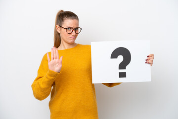 Young caucasian woman isolated on white background holding a placard with question mark symbol and...