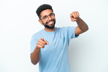 Fototapeta premium Young Brazilian man isolated on white background pointing front with happy expression