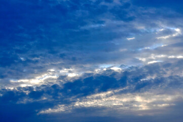 Naklejka na ściany i meble sunset over the clouds