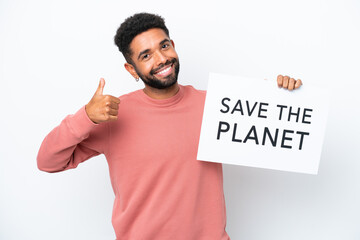 Young Brazilian man isolated on white background holding a placard with text Save the Planet with thumb up