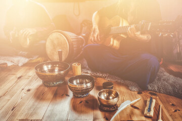 A still life of the shamanic drum and tibetan singing bowls.