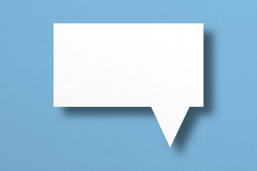 white paper with speech bubbles isolated on blue background communication bubbles