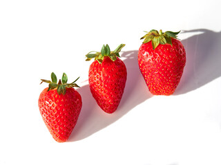 Fresh, red and delicious strawberries, on a white background