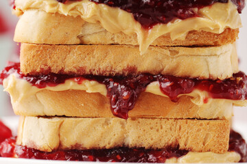 Sandwiches with peanut butter and raspberry jam