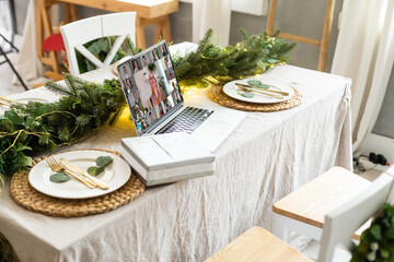 Virtual Christmas tree meeting team teleworking. Family video call remote conference. Laptop webcam screen view. Team meet working from their home offices. party online