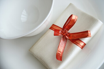 Table set in orange organza for a wedding banquet