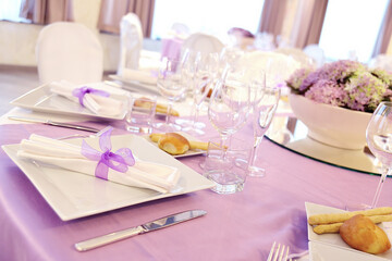 Detail of a table set in pink for a wedding banquet
