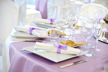 Detail of a table set in pink for a wedding banquet
