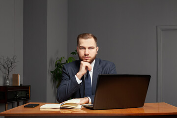 Serious businessman looking at camera
