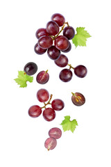 Red grape with green leaf on white background.